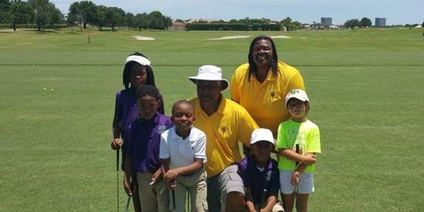The Foundation youth receive golf lessons from Jim Dent, 12 time PGA Tour Champion