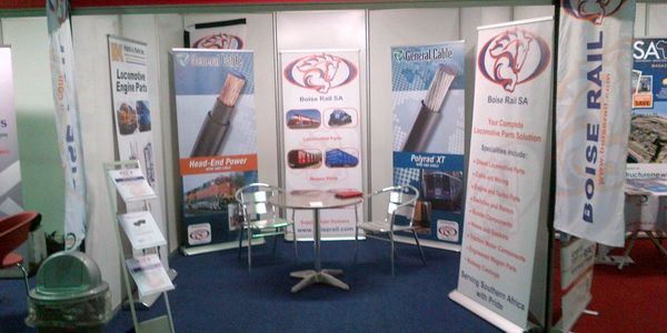 Trade show booth for Boise Rail SA showcasing locomotive parts and cables.