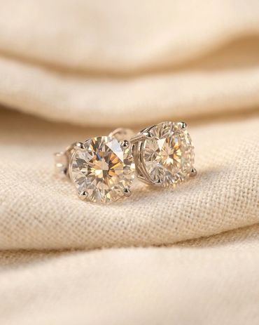 14K white gold diamond stud earrings in classic martini three-prong setting featuring 5.41 total car