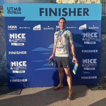 Andy Hood ultra runner at the finish line of UTMb Cote d'Azur