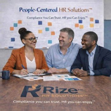 Three professionals smiling and discussing at a Rize HR Solutions meeting.