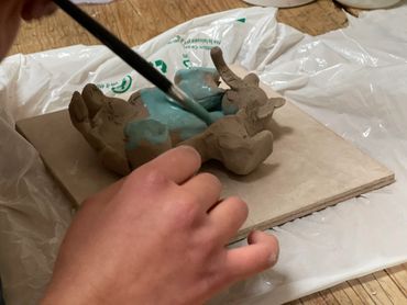 painting a pottery elephant