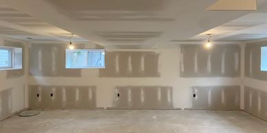 Basement renovation after the dry wall has been installed but not painted