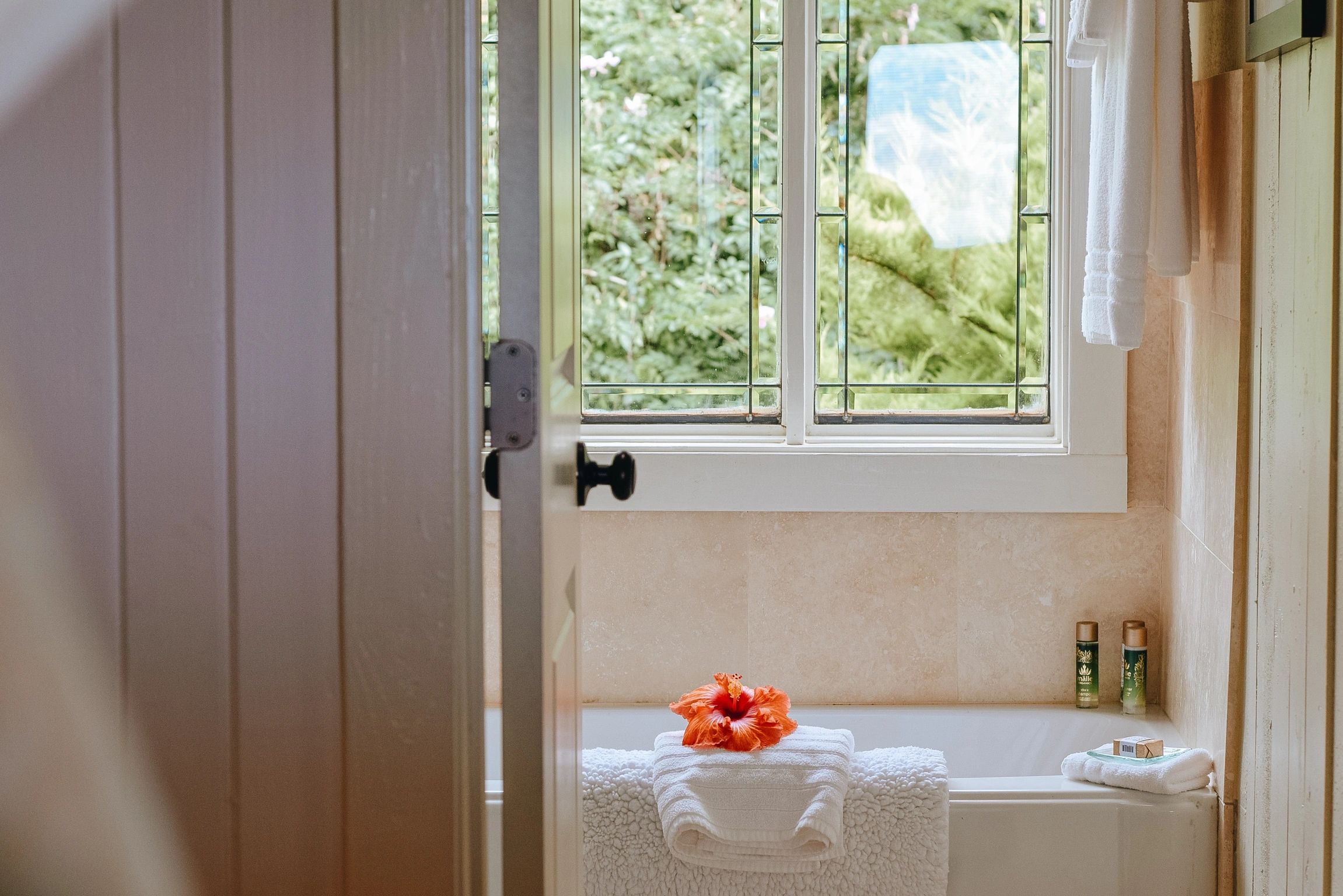 An elegant window above the bath.