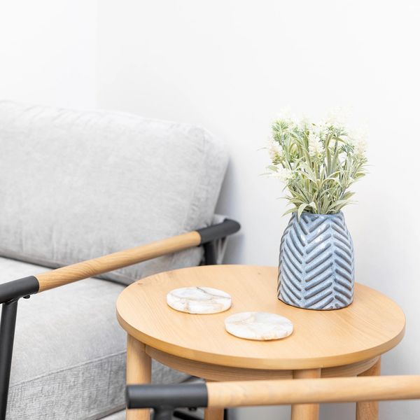 Calming therapy office nook with cozy seating and a vase of flowers at Maitland Mental Health Co.