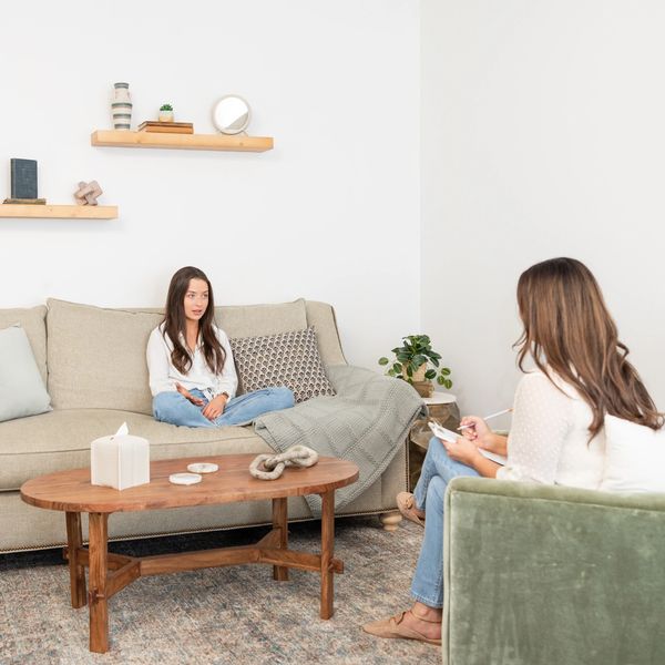 Teen girl in therapy session at Maitland Mental Health Co. with a licensed school psychologist.