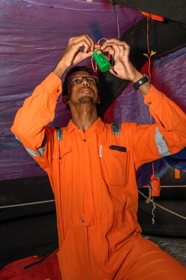 Connecting a light for  a liferaft.