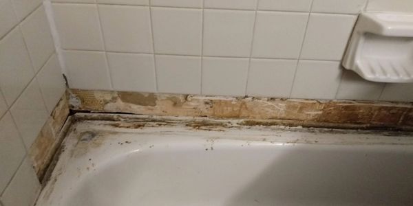 Bathroom shower wall tile repair/BEFORE