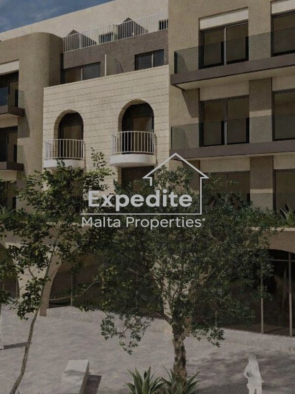 Modern apartment building with balconies and greenery in front.