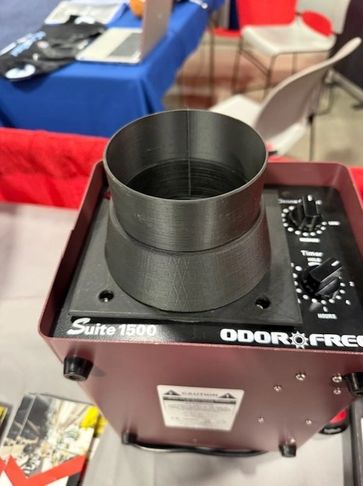Device with a black cylindrical attachment on top labeled Suite 1500 Odor Free.