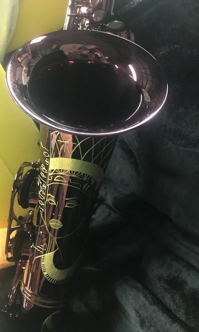 Smooth jazz saxophonist Earnest Walker Jr's tenor saxophone.  The Cannonball Diamond inlay Big Bell "Black Ruby".  The saxopne is a deep marone color with the Neffertti engraving.  