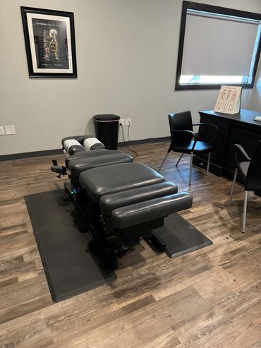 Treatment room 1 offers a flexion table with full drops and plenty of room for the whole family.