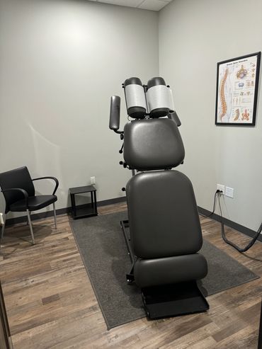 Treatment room 2 features a hylo chiropractic table for patients who are in pain or have trouble get