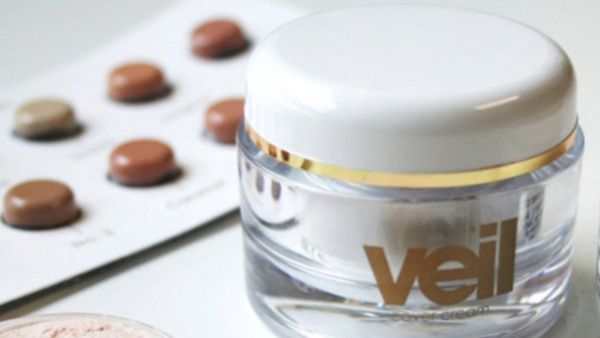 veil cover cream products, professional jar with sample kit in background and powder