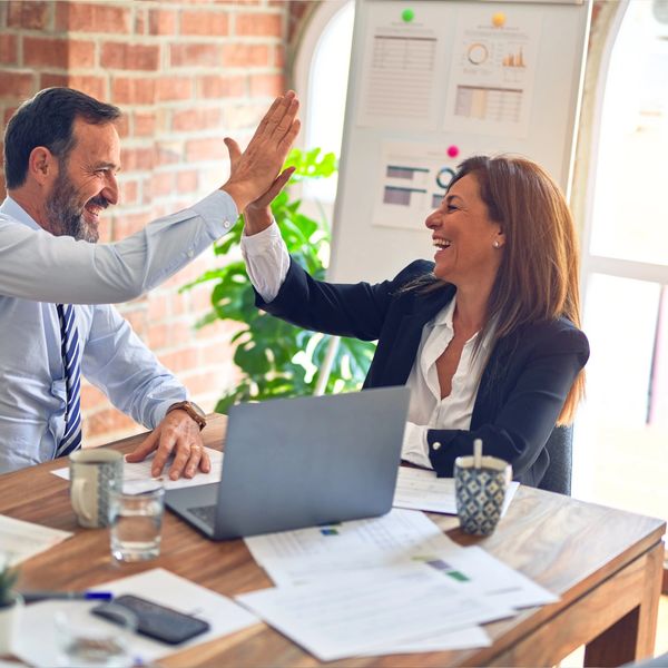A team of recruiters welcoming a candidate to a meeting