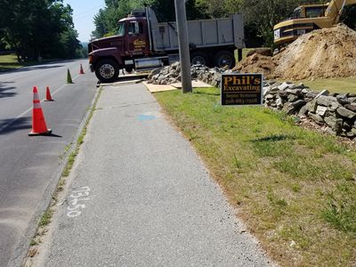 Phil's Excavating digs trench for water hookup