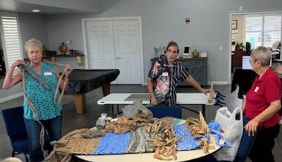 Kathy Winters from Leesburg demonstrating using "plarn" to make sleeping mats for the homless.