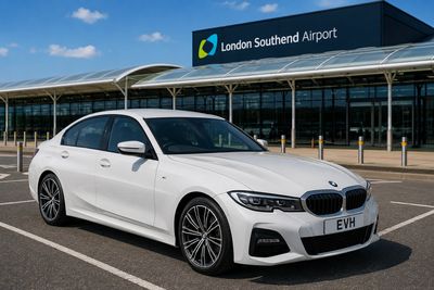 White BMW parked in front of London Southend Airport.