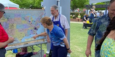 Rotarians looking at a map at Greer festival