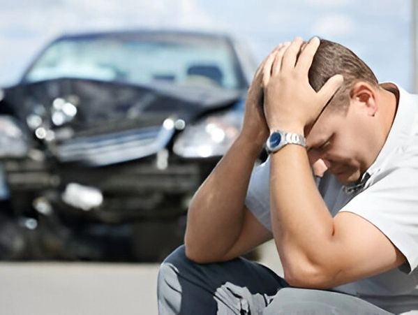 Distraught man after car accident.