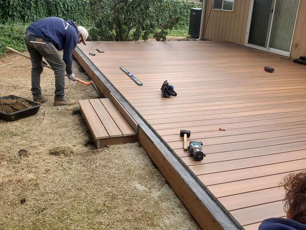 A man Installaing a Deck