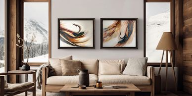 Cozy living room with abstract art and mountain views.