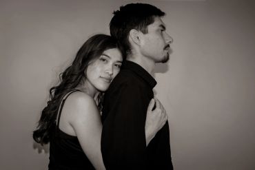 Couple embracing in a tender moment.