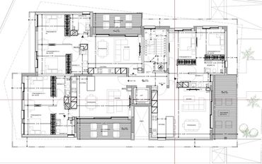 Architectural floor plan showing multiple apartments with rooms and furniture layouts.