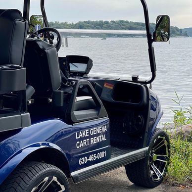 blue evolution golf cart in front of lake Geneva