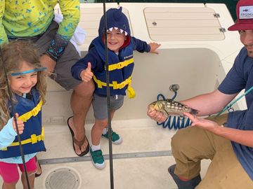 Children fishing on kids fishing trip local fishing off Huntington Beach calico bass intro to fishin