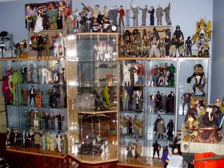 Figurine collection on shelf of various movie characters