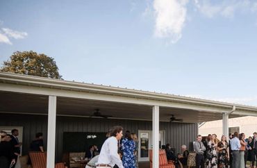 Guests celebrating outdoors at The Emerald Hill, a scenic North Carolina wedding venue.
