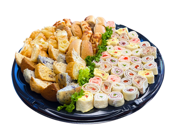 platter with bagels, muffins and fancy rolled sandwiches