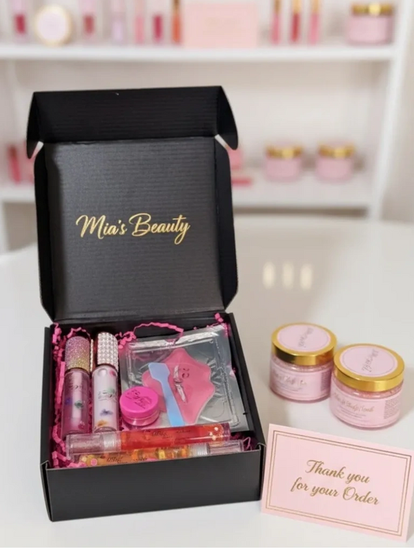 Mia's Beauty gift box with lip glosses, lip mask, and skincare jars, accompanied by a thank you card.