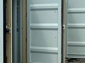 Storage containers with doors open on the gravel yard at Ultra Safe Storage in Ponder, Texas