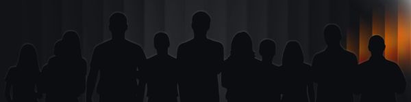 Silhouetted group standing against a dark, gradient background with warm light on one side.