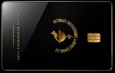 Elegant black and gold membership card with a chip and embossed text.