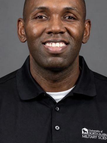 Portrait of a man in a University of North Alabama Military Science shirt.