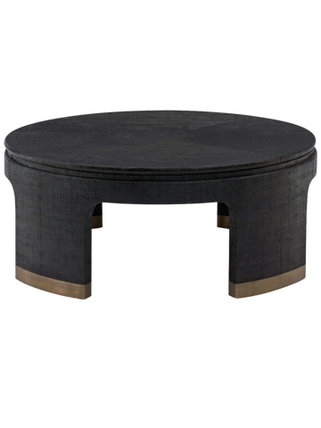 Round black coffee table with metallic accents at the base.