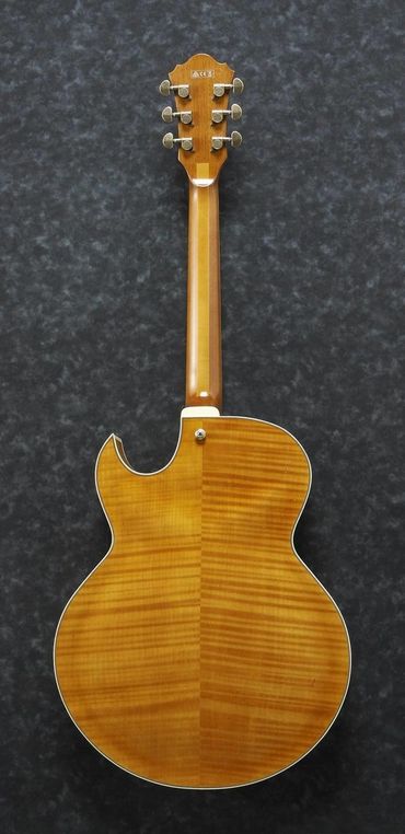 Back of a wooden acoustic guitar with a glossy finish.