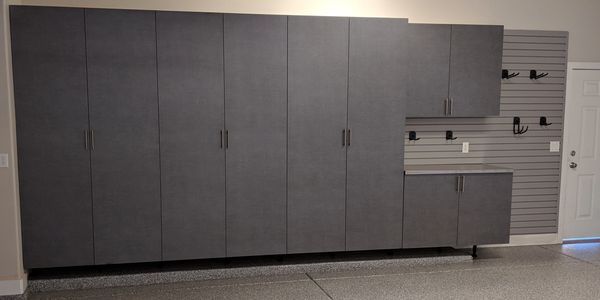 Pewter Garage Cabinets with a stainless steel countertop