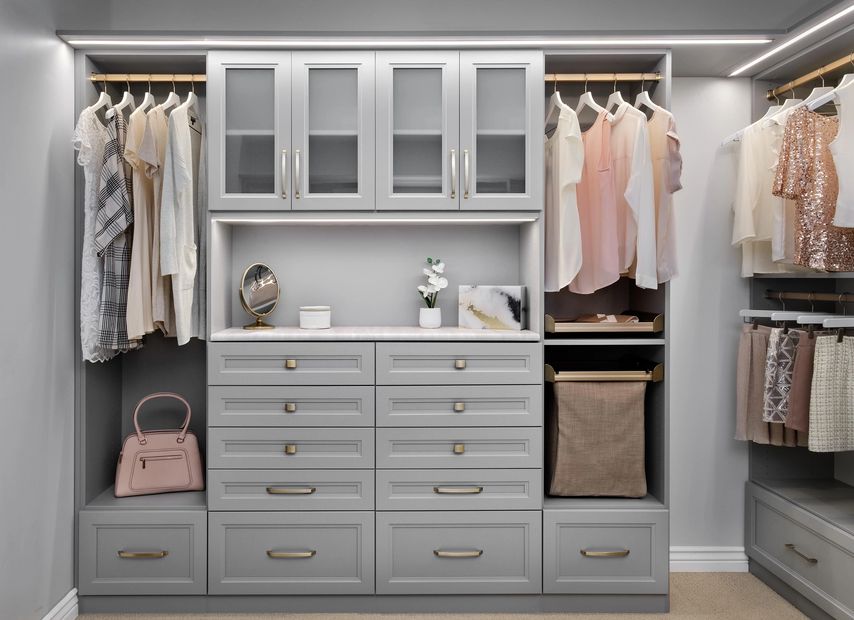 Walk-In closet in the New Super Matte Cloud Finish with Matte Gold Hardware and Strip Lighting