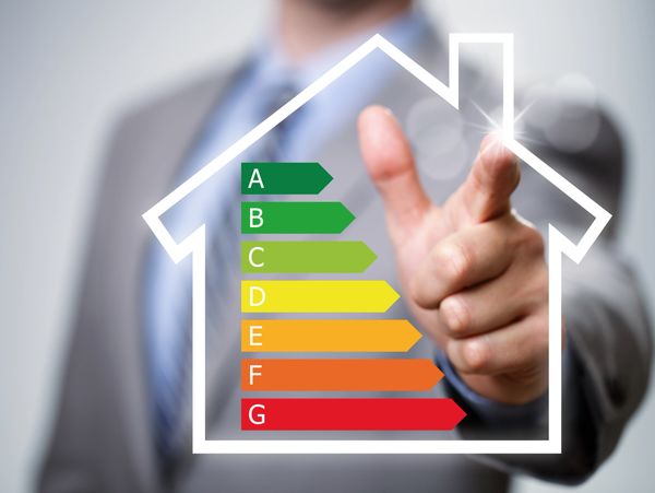 Businessman pointing to energy efficiency rating chart