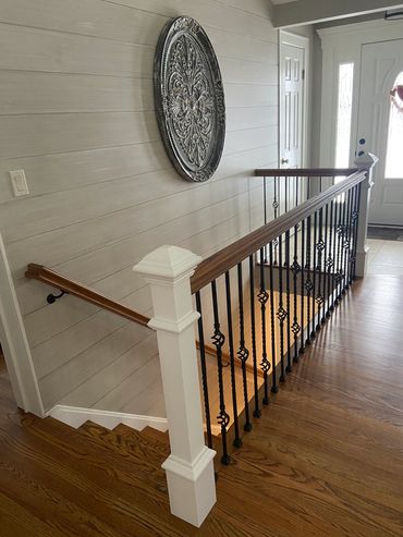 Custom stair rail installed by Fraccaroli Carpentry
