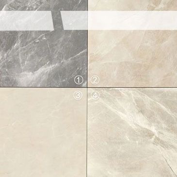 Four polished marble tiles in different shades and patterns.