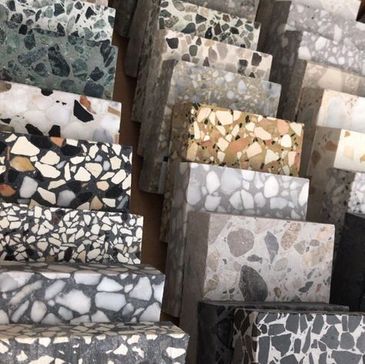 Various terrazzo stone samples with different colors and patterns.