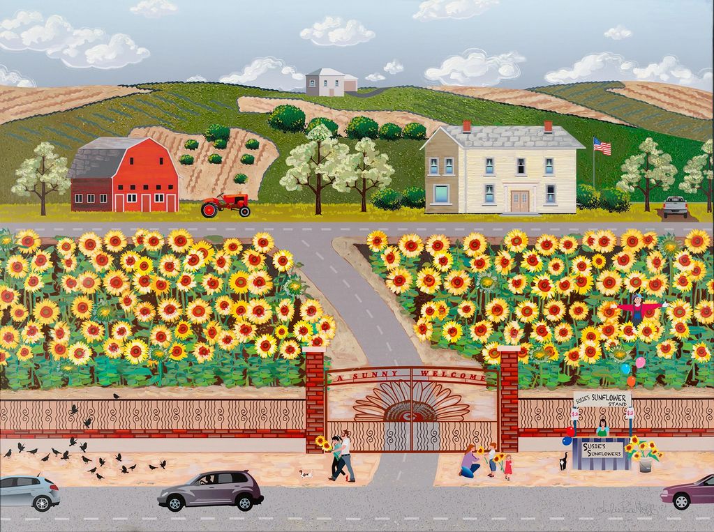 A sunflower farm filled with sunflowers and a country home, barn, and tractor.