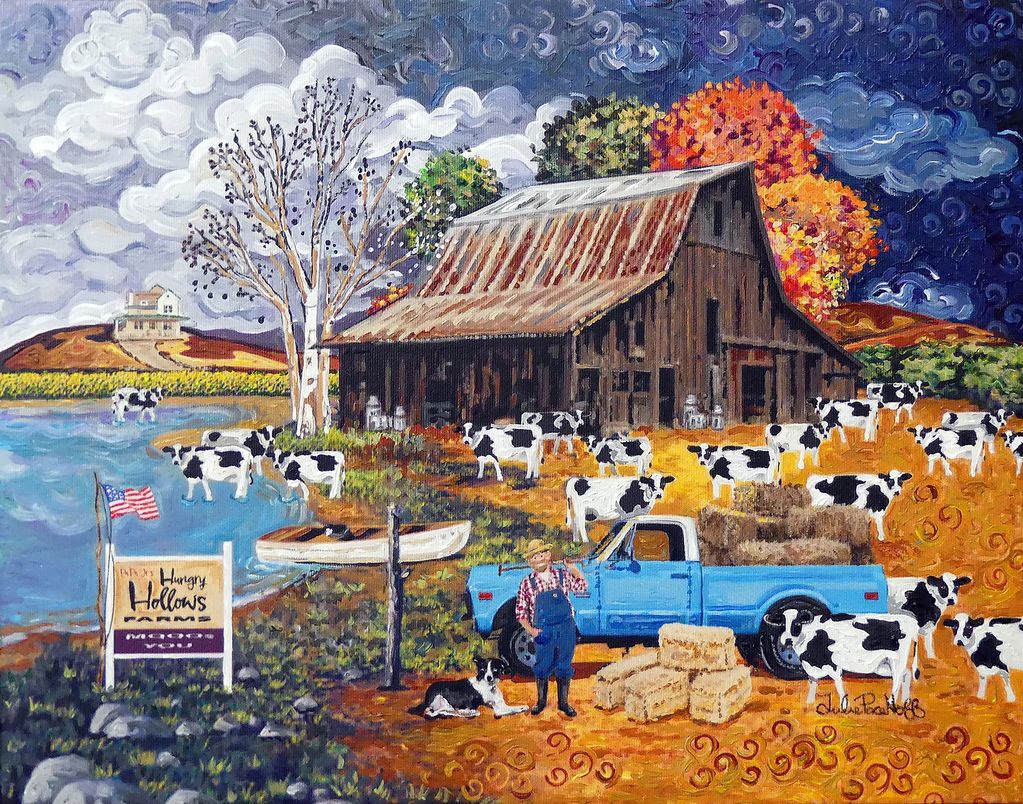 A farmer's barn with cattle.
