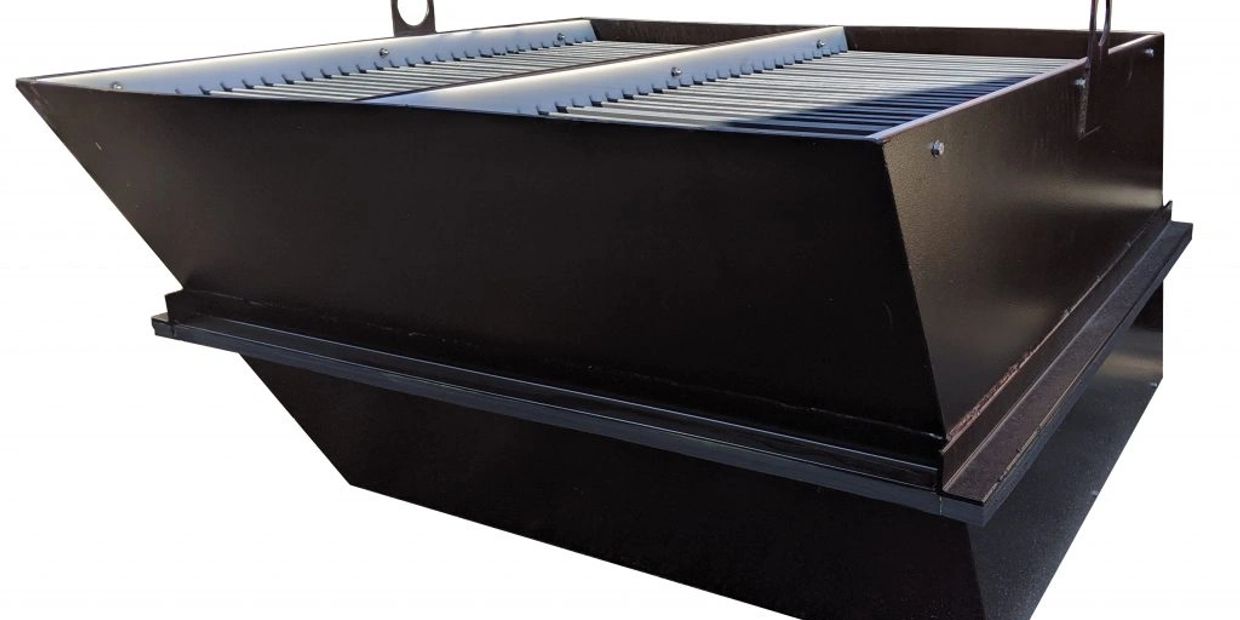 Large black metal industrial hopper or feeder box.