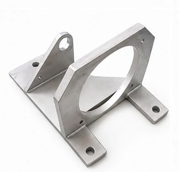 Metal bracket with circular and angled features.